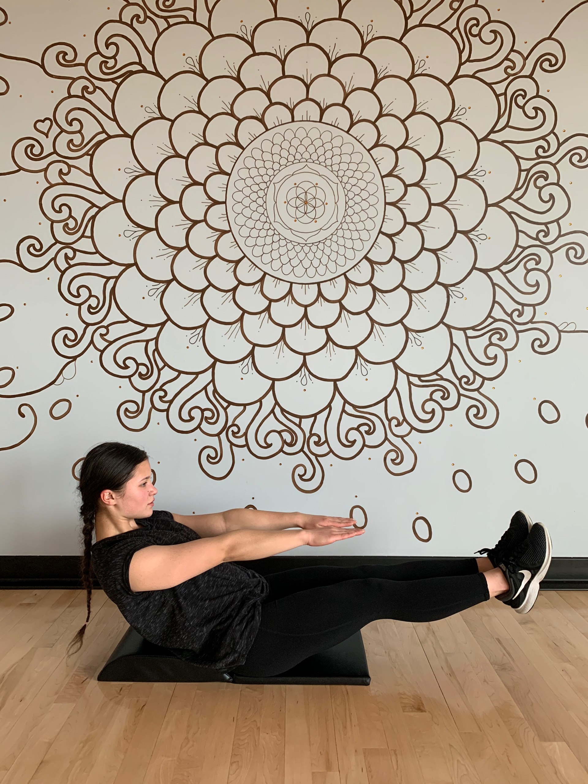Tailbone protector pad on Athlos Fitness ab mat